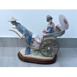 Lladro 1383 ‘A Rickshaw ride’ in good condition with plinth and original box
