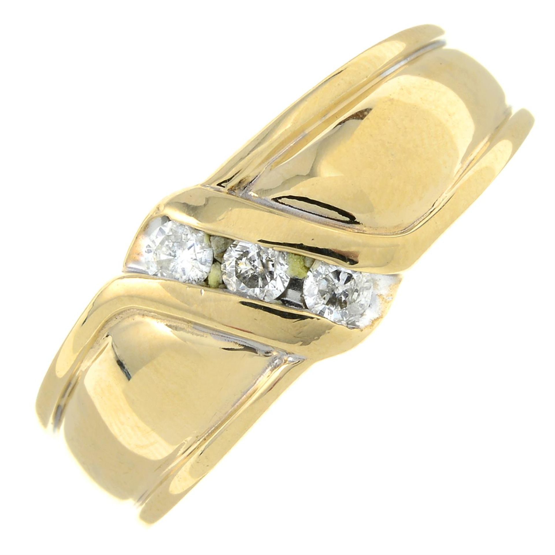 A 9ct gold diamond three-stone ring.