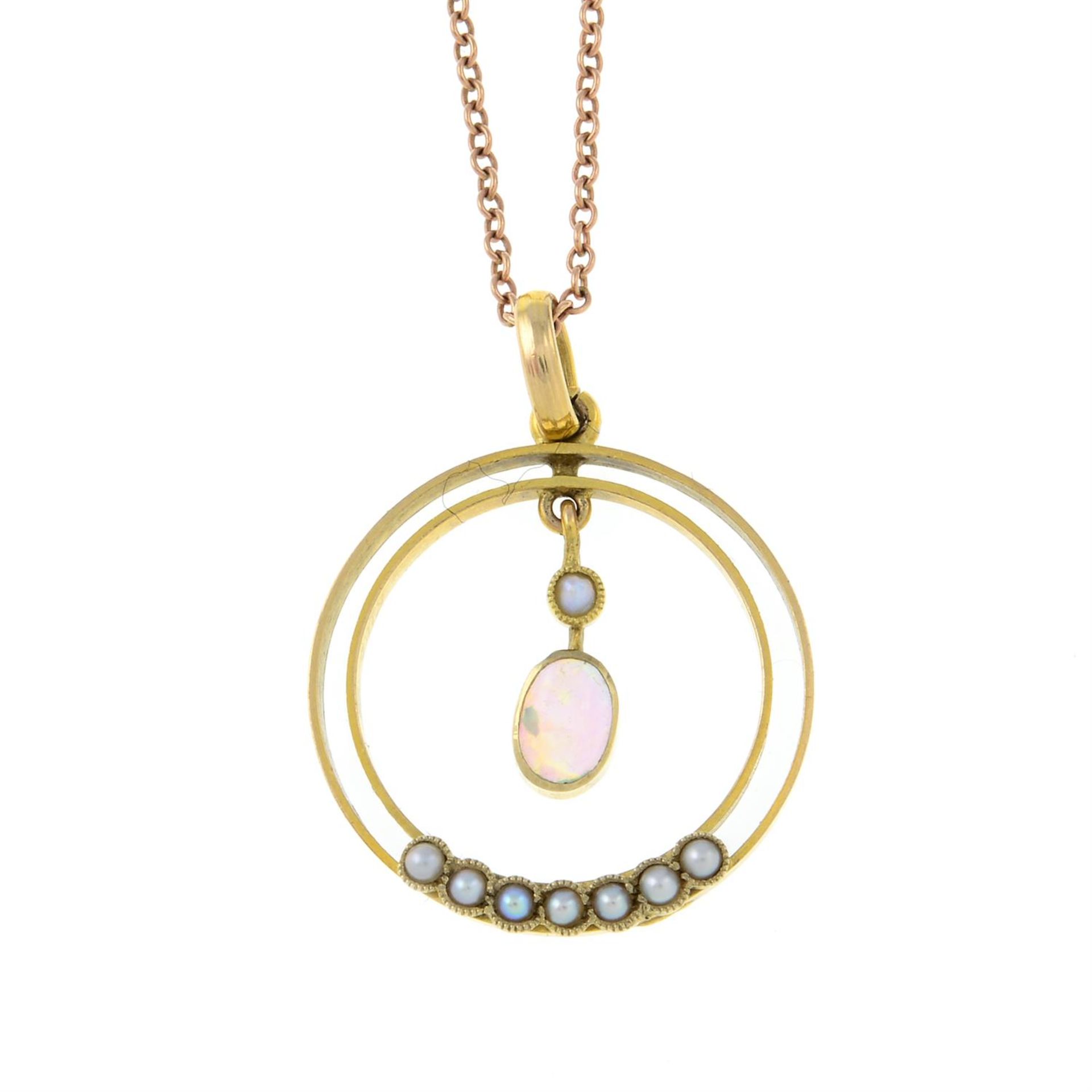 An early 20th century 9ct gold opal cabochon and seed pearl pendant, with chain.