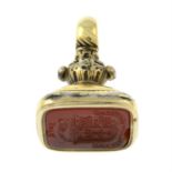 A late 19th century gold carnelian intaglio fob.