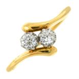 A mid 20th century 18ct gold old-cut diamond two-stone crossover ring.