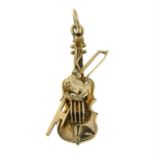 An early 20th century 9ct gold violin and frog charm/ pendant.