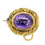 An early 19th century 14ct gold scroll motif amethyst brooch.