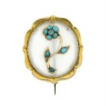 An early 20th century gold chalcedony and turquoise floral brooch.