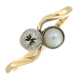 An early 20th century old-cut diamond and split pearl crossover ring.