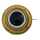A mid 19th century gold agate brooch.
