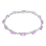 A 9ct gold synthetic pink sapphire and diamond bracelet.