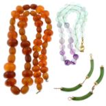 A nephrite bracelet, a fluorite bead necklace and an amber necklace. One AF.