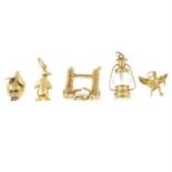 Five 9ct gold charms.