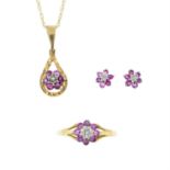 A set of 9ct gold ruby and diamond jewellery, comprising a necklace, a pair of earrings and a ring.