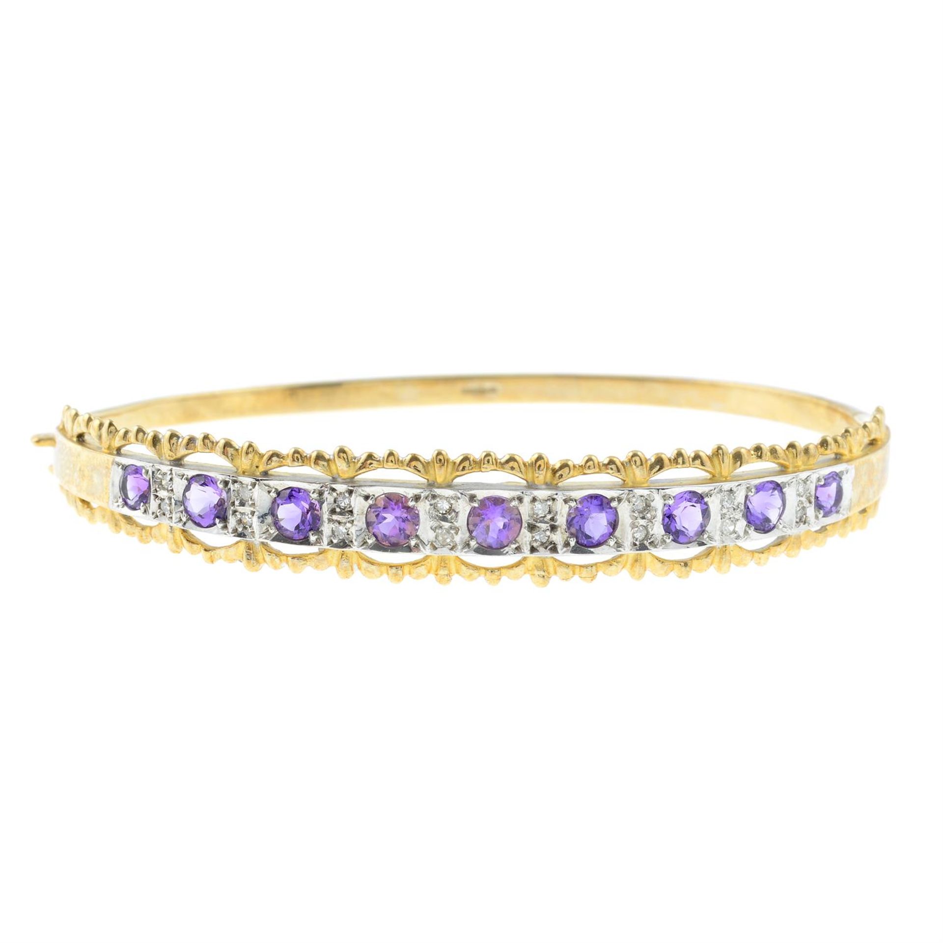 A 9ct gold amethyst bangle, with diamond spacers.