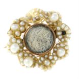 A mid 19th century 9ct gold seed pearl and mother-of-pearl memorial brooch.