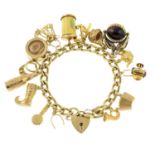 A 9ct gold curb-link charm bracelet, suspending fifteen charms, gathered at a 9ct gold clasp.