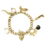 A 9ct gold charm bracelet, suspending eight charms.