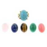 A gem-set dress ring, with interchangeable gemstones.