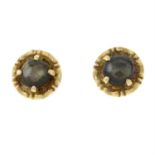A pair of black sapphire stud earrings.
