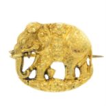 A brooch, depicting a ceremonial elephant.