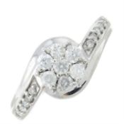 A 9ct gold diamond floral cluster ring, with diamond shoulders.