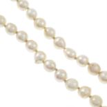A single-strand of cultured pearls and three imitation pearls.