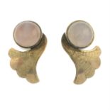 A pair of rose quartz cabochon earrings.