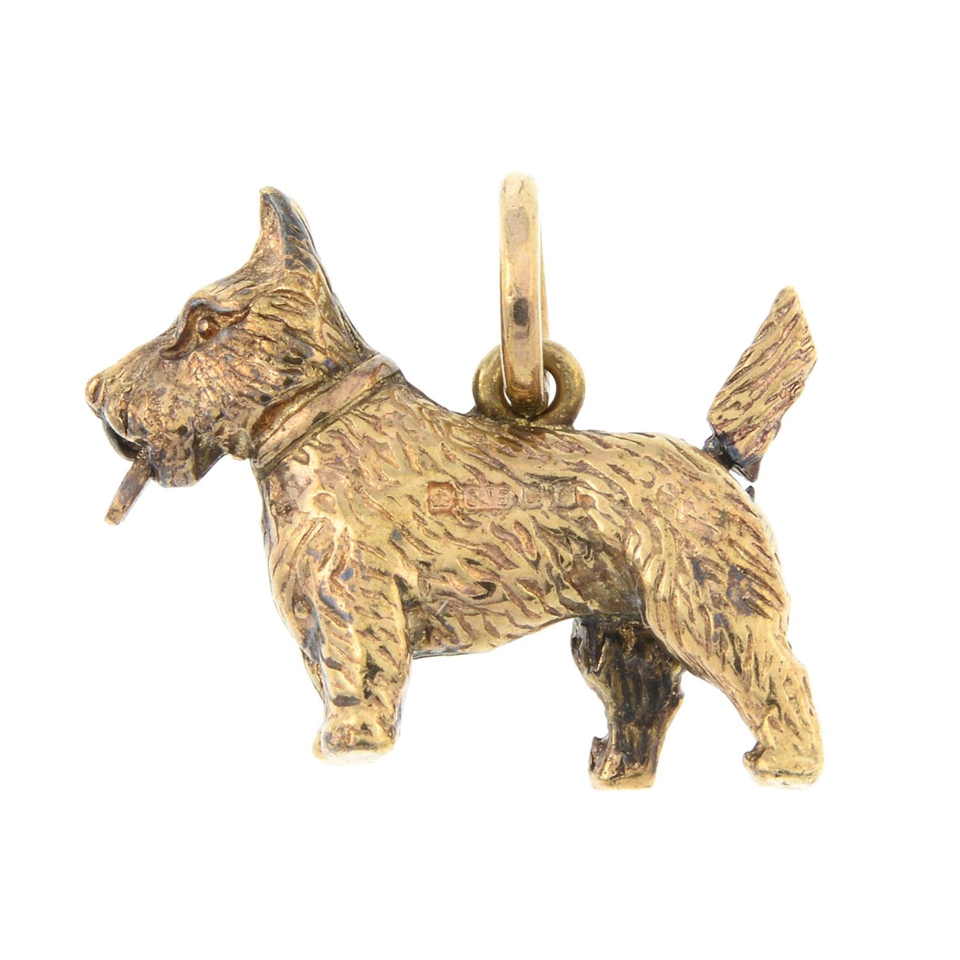 A 9ct gold Scottish terrier charm, with articulated tail and tongue.