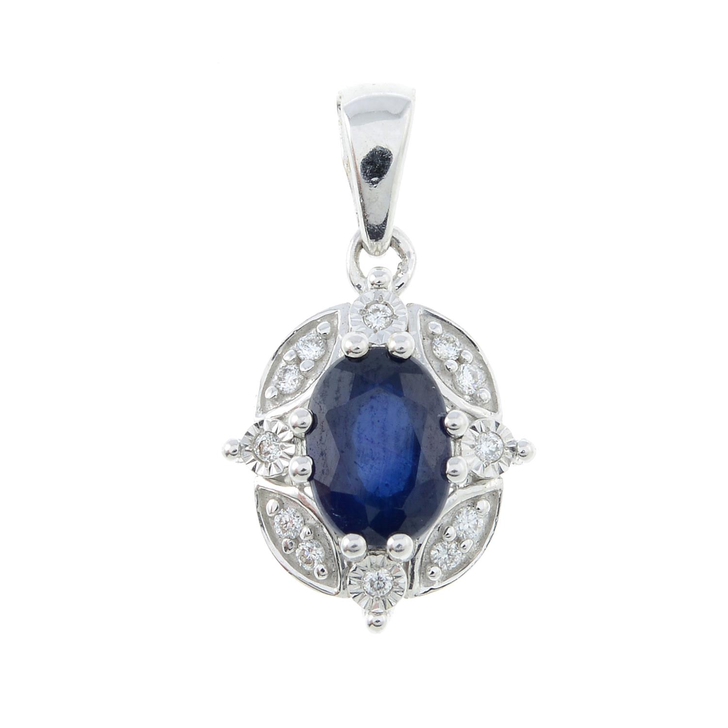 A sapphire and diamond pendant.