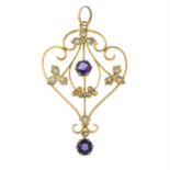 A late Victorian 9ct gold split pearl and amethyst openwork pendant.