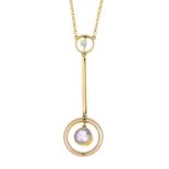 An early 20th century 9ct gold amethyst and seed pearl drop pendant, on an integral trace-link
