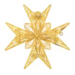 A filigree Maltese cross pendant.