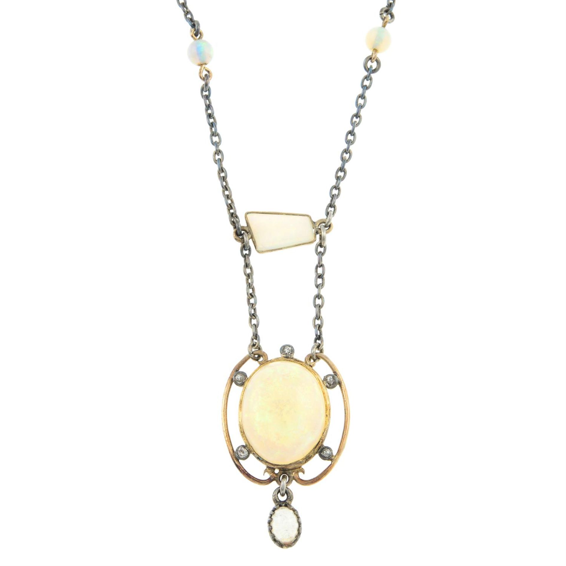 An early 20th century opal and diamond drop pendant, on an integral fancy-link chain.