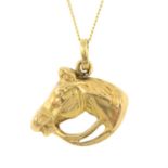 A horse head pendant, with trace-link chain.