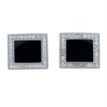 A pair of onyx and pavé-set diamond cufflinks.