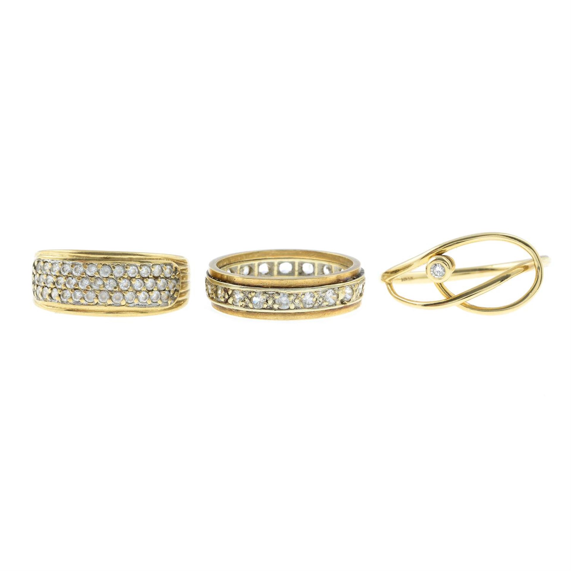 Two 9ct gold gem-set rings and a paste full eternity ring.