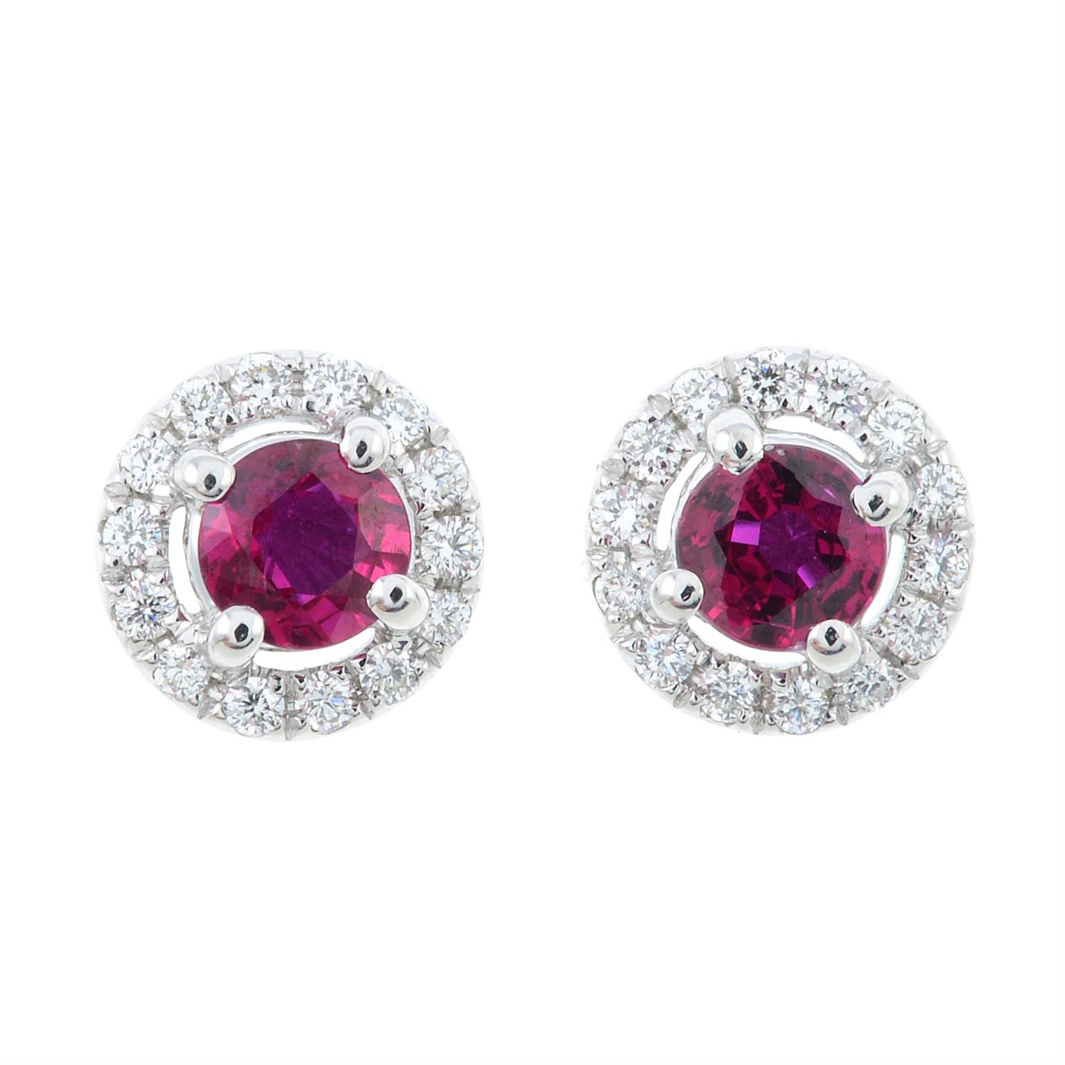 A pair of ruby and diamond cluster earrings.