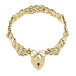 A 9ct gold gate-link bracelet, with heart-shape padlock clasp.