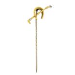 An early 20th century 15ct gold horseshoe and riding crop stickpin.