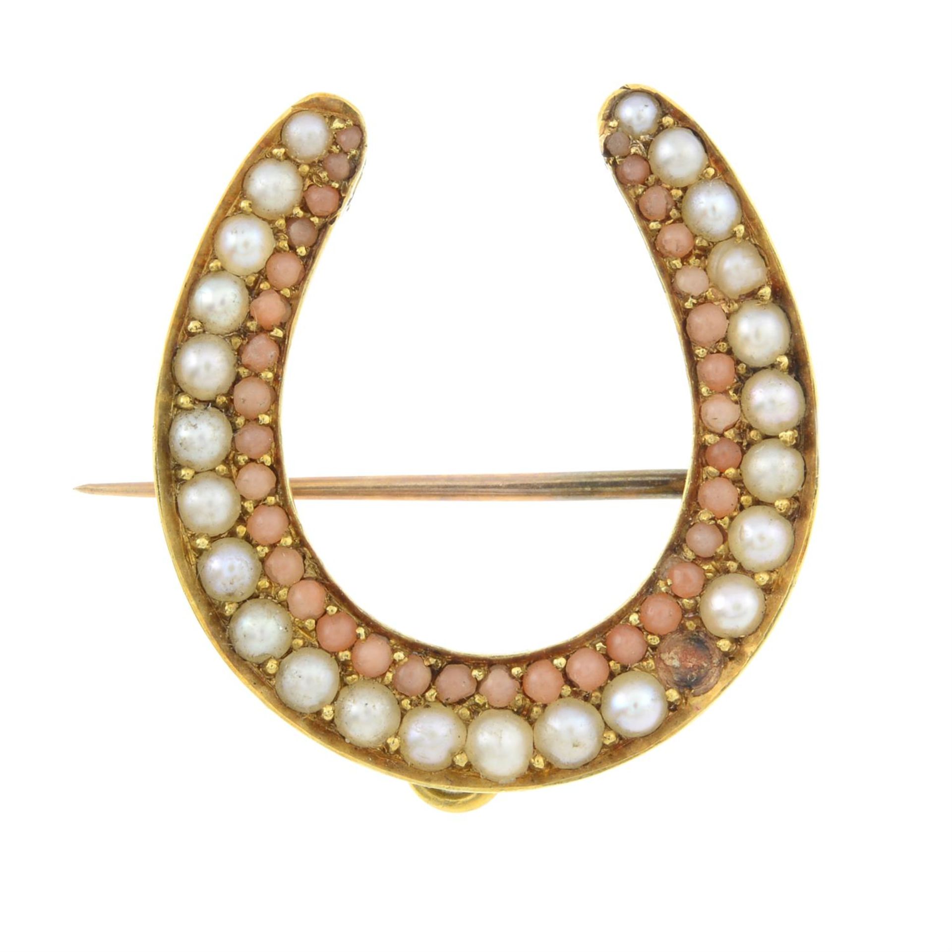 A late 19th century gold split pearl and coral horseshoe brooch/pendant.