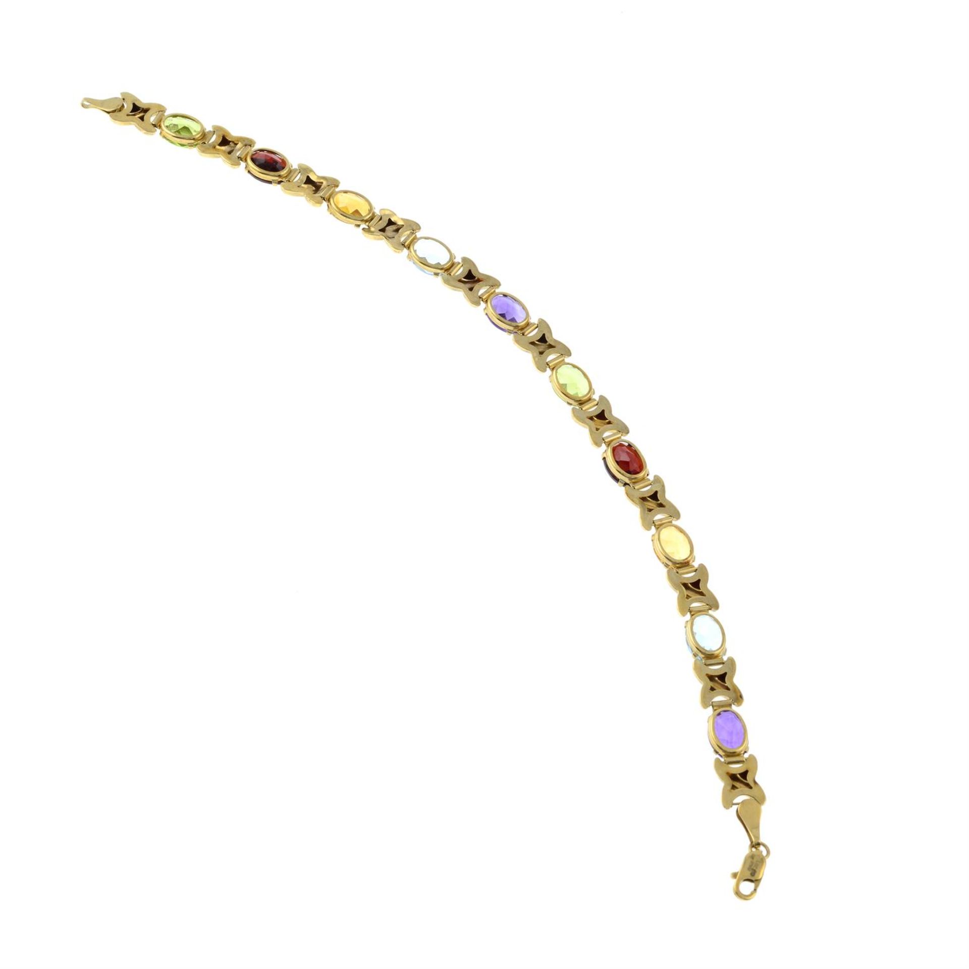 A 9ct gold peridot, garnet, citrine, blue topaz and amethyst bracelet. - Image 2 of 2