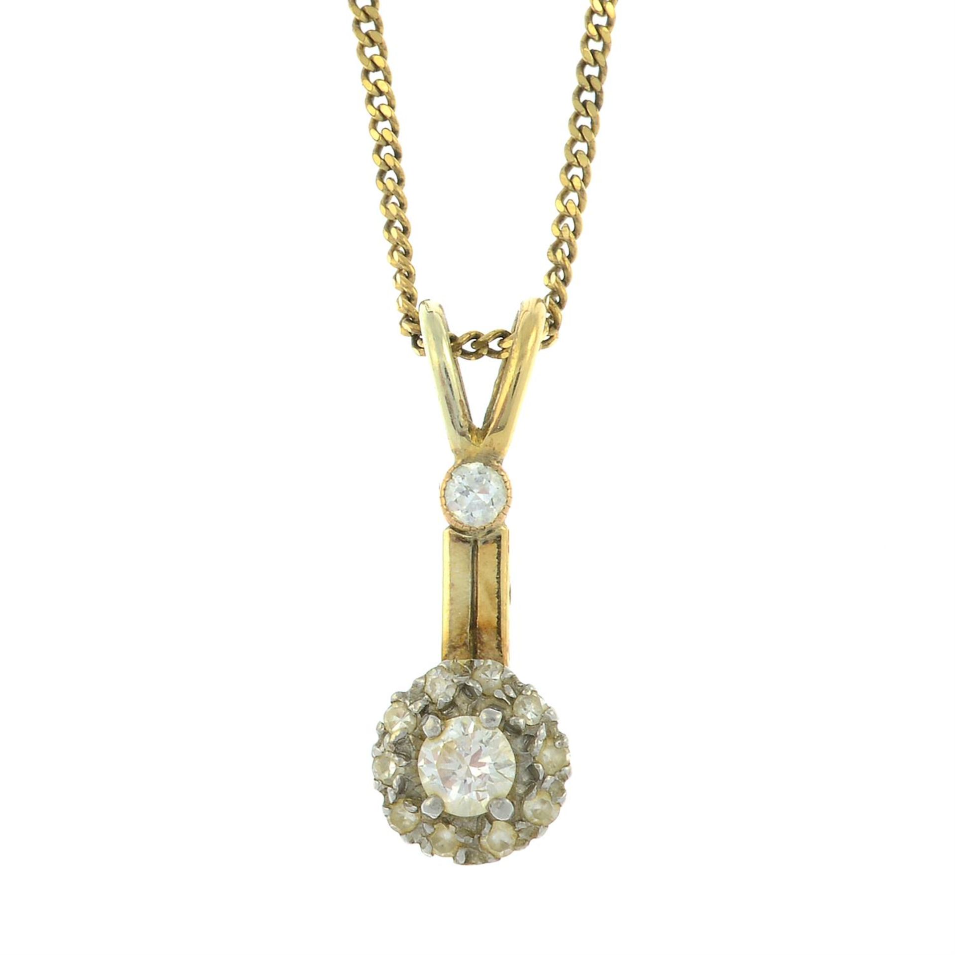 A vari-cut diamond cluster drop pendant, with an 18ct gold curb-link chain.