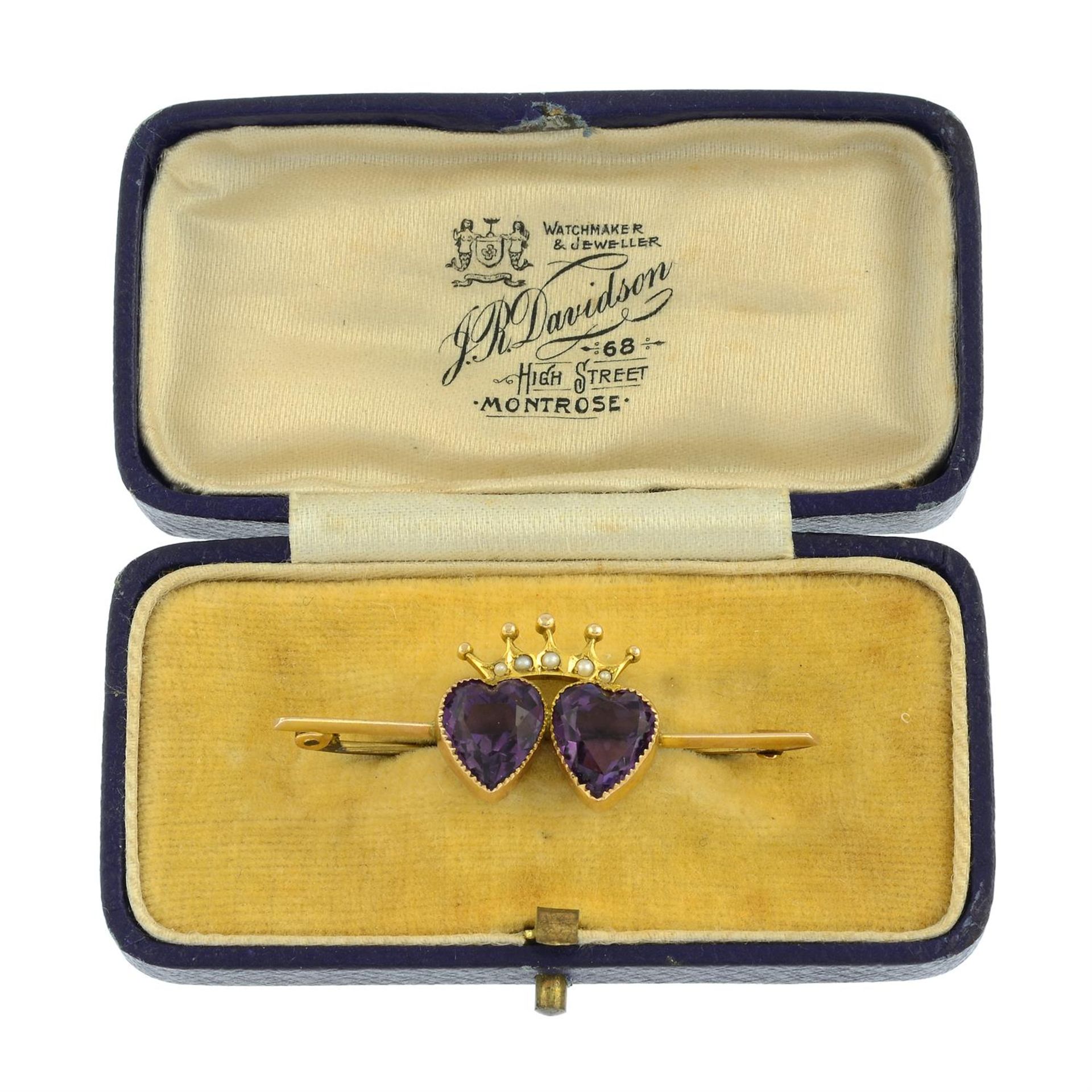 An early 20th century amethyst and seed pearl double heart and crown brooch. - Image 3 of 3