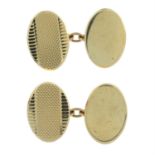A pair of mid 20th century 9ct gold textured cufflinks.
