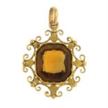A mid 19th century gold citrine floral pendant.
