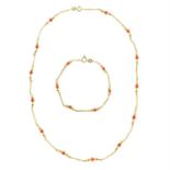 A coral bead necklace, with matching bracelet.