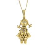 A 9ct gold articulated ragdoll pendant, with 9ct gold trace-link chain.