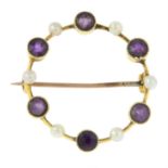An early 20th century 9ct gold amethyst and seed pearl wreath brooch.