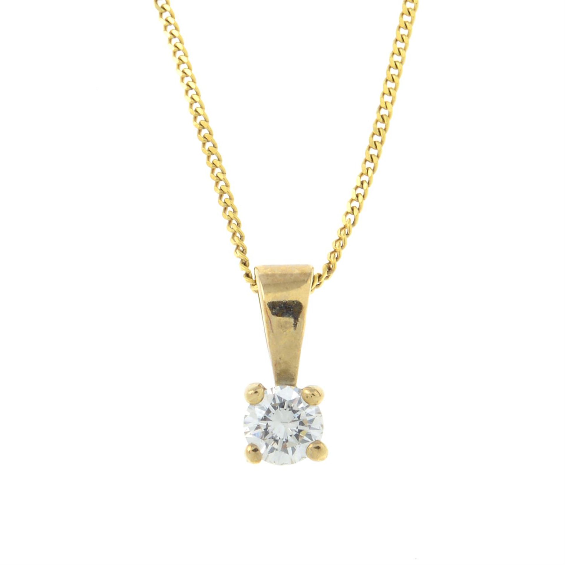 A diamond single-stone pendant, with trace-link chain.