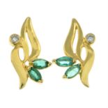 A pair of diamond and emerald earrings.