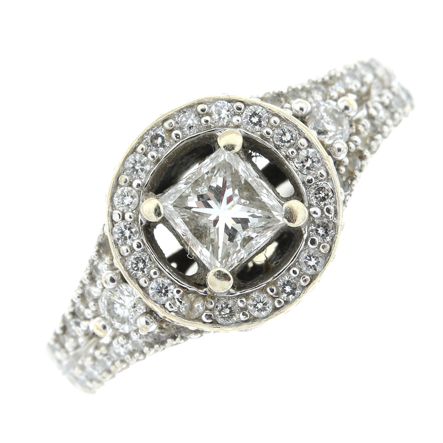 A square-shape diamond ring, with brilliant-cut diamond shoulders.