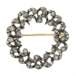 A mid Victorian silver and gold rose-cut diamond wreath brooch.
