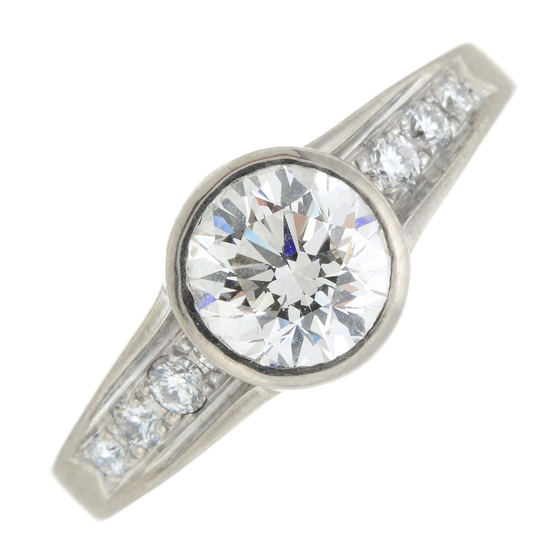 An old-cut diamond single-stone ring, with brilliant-cut diamond line shoulders.